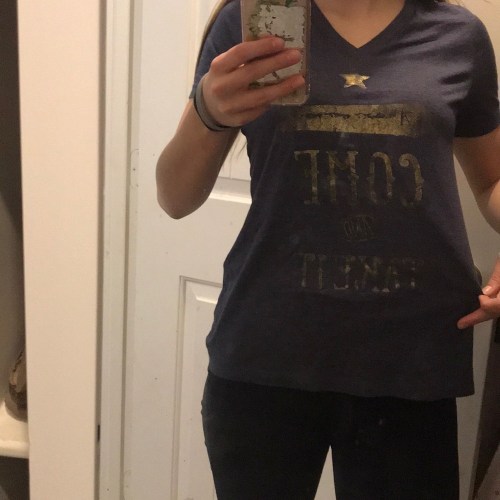 v neck T, says “come and take it”